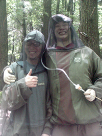 Summer interns with protective bug gear