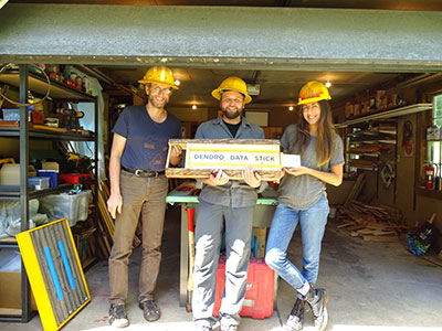 [	 Pic 1: My mentors, David Buckley and Aaron Ellison and I holding the Dendro Data Stick art piece. ]