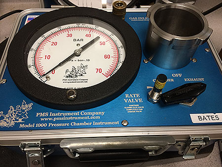 [Pressure chamber, a.k.a “pressure bomb,” used to measure the water potential of leaves.]