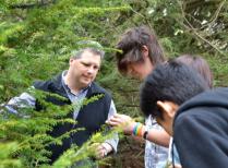 HF forest ecologist Dave Orwig shows hemlock woolly adelgid to high schoolers