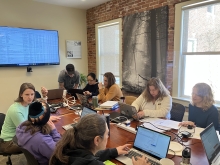 Image shows Schoolyard Ecology workshop participants sitting at a table.