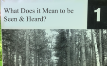 a trail sign that says "What Does it Mean to be Seen and Heard?"