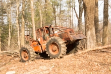 Image shows a skidder pulling logs at Harvard Forest. 