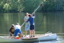 A group pond coring on canoes 