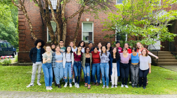 Students and proctors from the 2022 research program stand at Harvard Forest's campus.