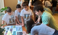 Image shows students reviewing a poster at Harvard Forest's 2024 Data Jam. Photo by student Ava Rubin.