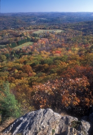 View from Lions Head in Connecticut, part of the Appalachian Trail, showing a mosaic of hills, forests, and farms in autumn. Photo by John Burk. 