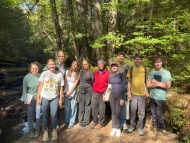 Image shows the 2024 First-Year Seminar students at the Swift River in Petersham.