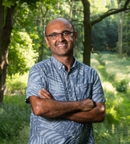 Image shows Professor Yadvinder Mahli standing in the woods.