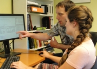 Matthew Duveneck and Sofie McComb analyzing data in the scripting language R