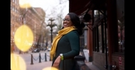 Tiffany Carey stands smiling on a city street