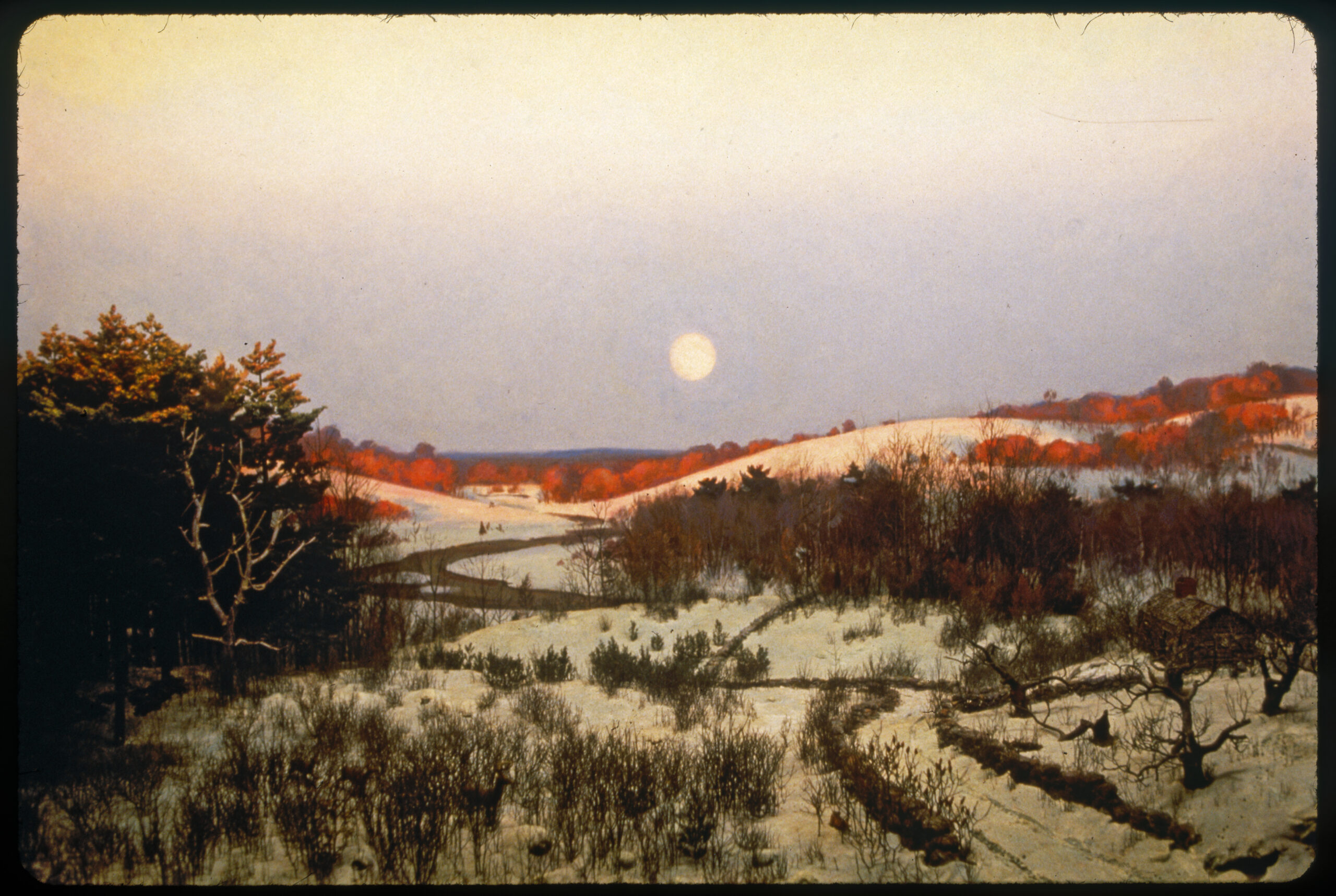 Diorama scene of a snowy landscape with an abandoned farmhouse and two deer